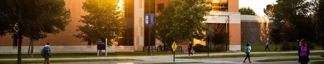 students walking around an academic building